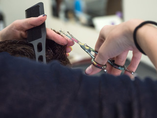 The technique of cutting with scissors. 