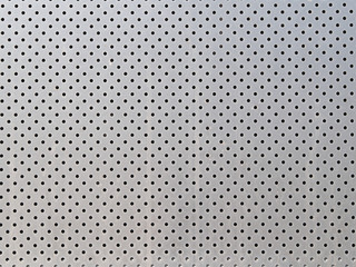 Metal texture with regular holes. Decorative facade panel
