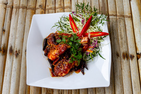 SEAFOOD - KONG SACUE MAKHAM : DEEP FRIED PROWNS IN SWEET AND SPICY TAMARIC SAUCE, TRADITIONAL THAI FOOD IN THAILAND.