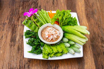 SEAFOOD - NAM PRIK KOONG SOD : HOT AND SPICY DIPPING CHILI PASTE SAUCE IN SOUTHERN THAI STYLE SERVED WITH VARITIES OF FRESH VEGETABLES, KRABI THAILAND.