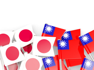 Pins with flags of Japan and taiwan isolated on white.