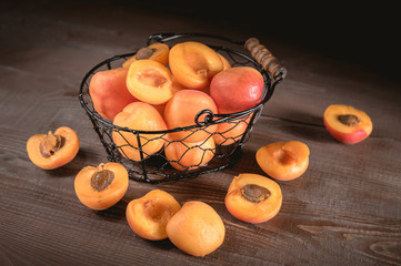 Delicious ripe apricots in a bowl on the table