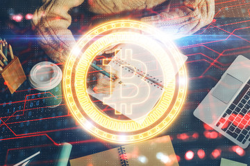 Cryptocurrency hologram over hands taking notes background. Concept of blockchain. Multi exposure