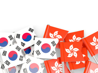 Pins with flags of South Korea and hong kong isolated on white.