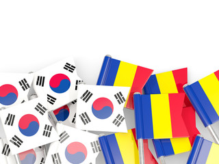 Pins with flags of South Korea and romania isolated on white.