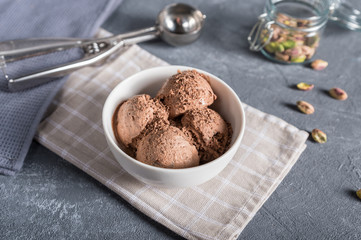 Bowl of chocolate ice cream on rustic background