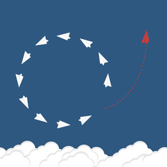 Think differently concept. Be different. Red airplane changing direction. New idea, change, trend, courage, creative solution, innovation and unique way concept.