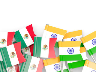Pins with flags of Mexico and india isolated on white.