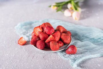 Fresh strawberries in a bowl on rustic background
