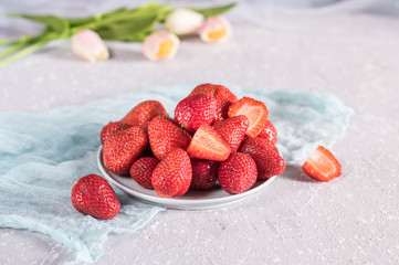 Fresh strawberries in a bowl on rustic background