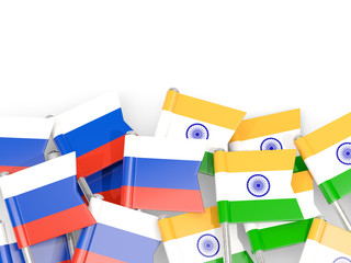 Pins with flags of Russia and india isolated on white.