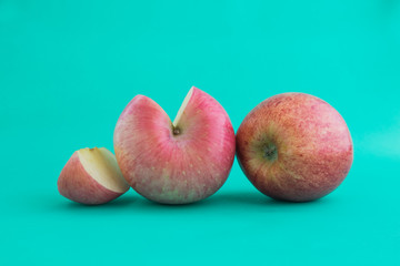 Red apple on colored background