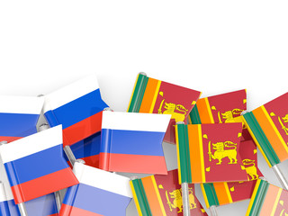 Pins with flags of Russia and sri lanka isolated on white.