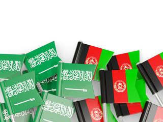 Pins with flags of Saudi Arabia and afghanistan isolated on white.