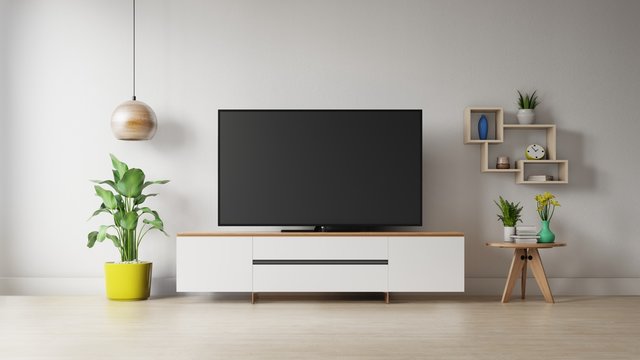 TV on the cabinet in modern living room with plant on white wall background,3d rendering