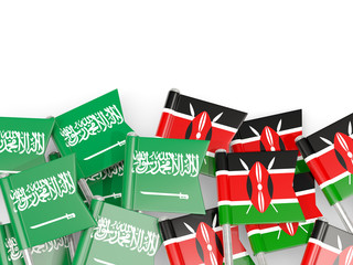 Pins with flags of Saudi Arabia and kenya isolated on white.