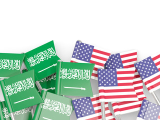 Pins with flags of Saudi Arabia and United States isolated on white.