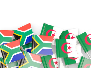 Pins with flags of South Africa and algeria isolated on white.