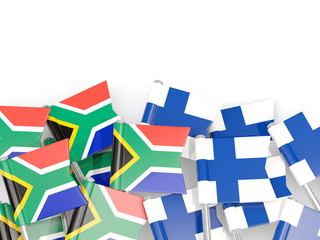 Pins with flags of South Africa and finland isolated on white.