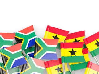 Pins with flags of South Africa and ghana isolated on white.
