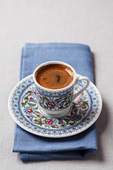 Black coffee in traditional Turkish cup