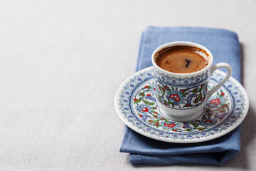 Black coffee in traditional Turkish cup