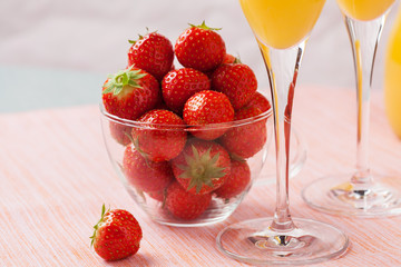 Mimosa cocktail and strawberries