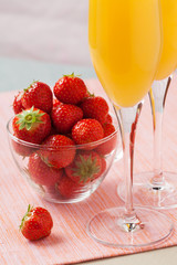 Mimosa cocktail and strawberries