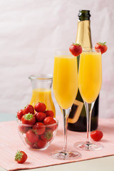 Mimosa cocktail and strawberries