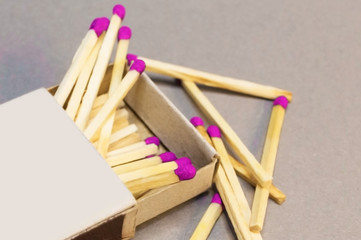 Wooden matches in a box scattered close-up