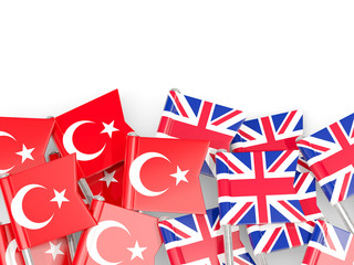 Obraz premium Pins with flags of Turkey and UK isolated on white.