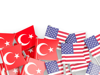 Pins with flags of Turkey and United States isolated on white.