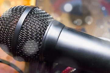 Microphone on a blurred background and particles close-up
