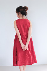 Vintage Fashion Portrait of Young  asian woman with bun hair style wearing red dress linen clothing - copy space white background