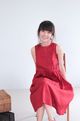 Vintage Fashion Portrait of Young  asian woman with bun hair style wearing red dress linen clothing - copy space white background