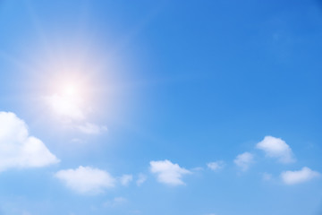Beautiful white clouds with sun on blue sky.Color shade gradient from white to blue for background wallpaper.