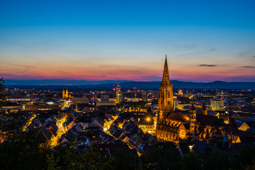 Fototapeta na wymiar Germany, Romantic evening mood over city freiburg im breisgau in magic hour