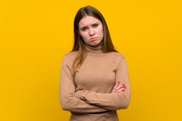 Obraz premium Young woman over colorful background sad