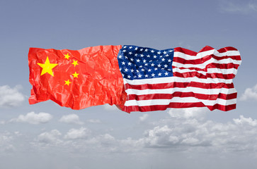 Wrinkle of USA and China flag on sky background. It is symbol of United states of America and China...