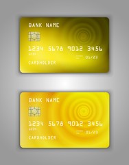 Obraz premium Realistic plastic Bank card vector template. Figure spiral gradient. Background color yellow