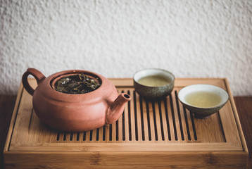 Chinese Gongfu tea ceremony with Oolong tea on chaban table