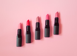 Set of beautiful lipsticks on pink background - obrazy, fototapety, plakaty