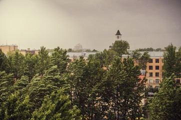 Stormy sky above the centre of Saint-Petersburg, Russia. St Petersburg typical weather. Wind in the trees on a rainy day.