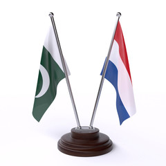 Pakistan and Netherlands, two table flags isolated on white background. 3d image