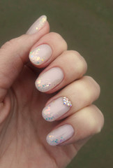 fashion manicure with glitter. natural color