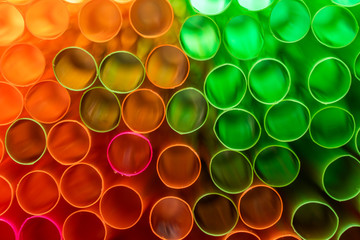 A close up shot of colored straws. The straws are used to drink drinks without putting your mouth to the glass