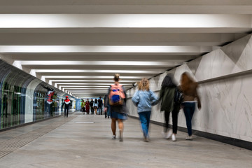people go through the underpass in motion and blur