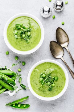 Summer cream soup with green fresh pea shoots