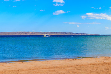 White motorboat sailing in the Red sea, Egypt