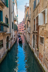 Fototapeta na wymiar Venice, city of Italy. View of the canal, the Venetian landscape with boats and gondolas